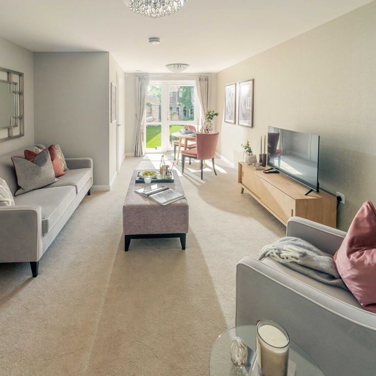 a living room with a couch and a tv