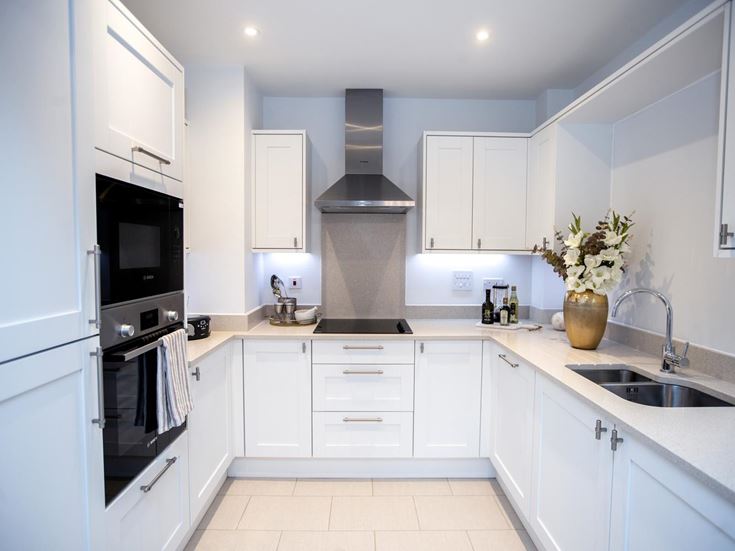 a kitchen with white cabinets