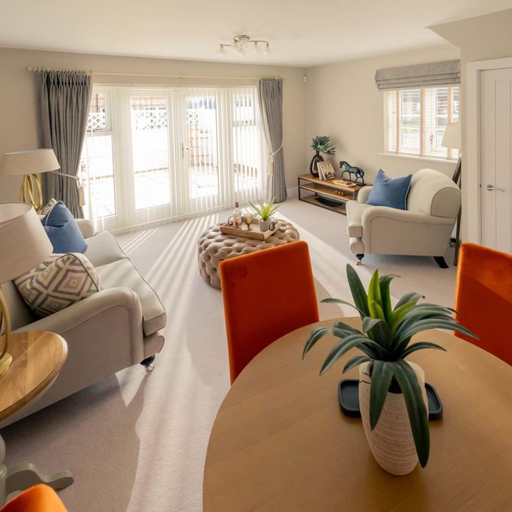 a living room with a couch and a table