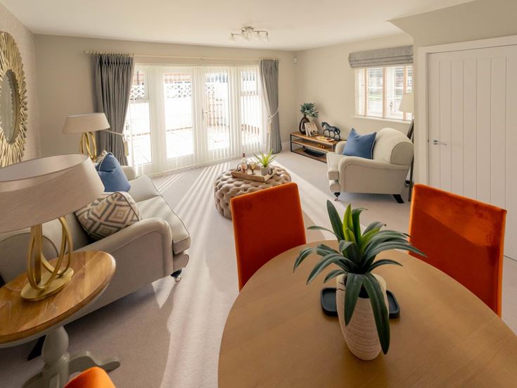 a living room with a couch and a table