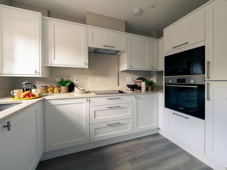 a kitchen with white cabinets