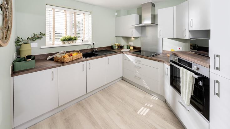 a kitchen with white cabinets