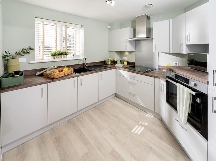 a kitchen with white cabinets