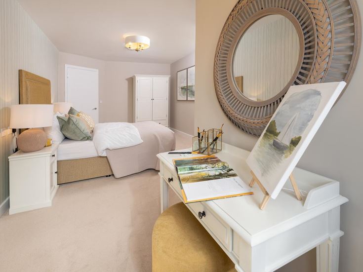a bedroom with a mirror and a bed