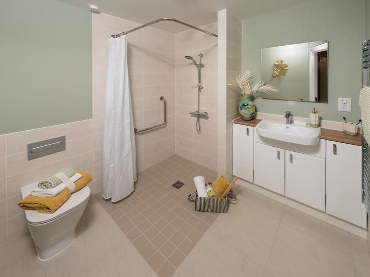 a bathroom with a shower and sink