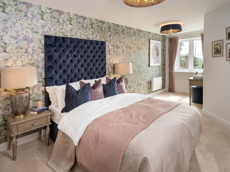 a bedroom with a bed and a table