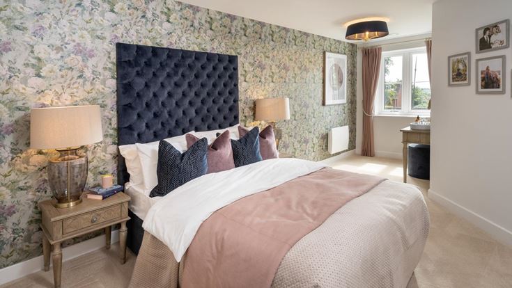 a bedroom with a bed and a table