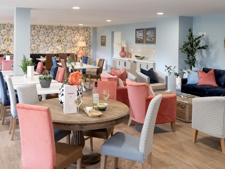 a dining room with a table and chairs