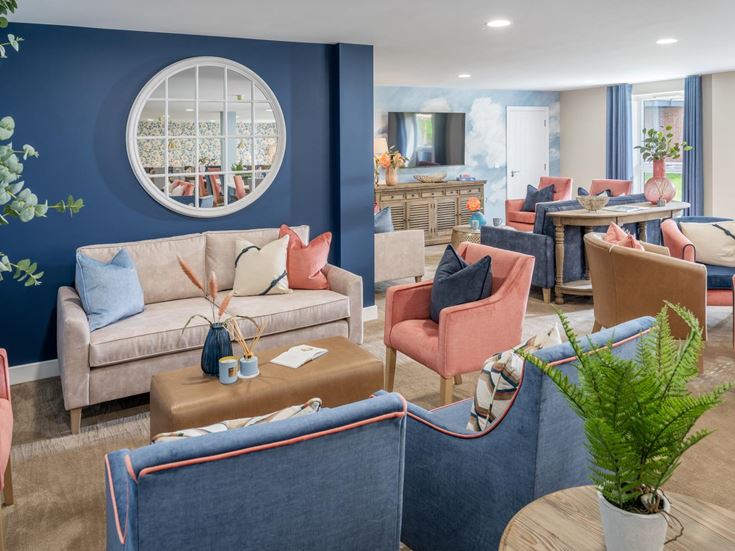 a living room with a blue wall