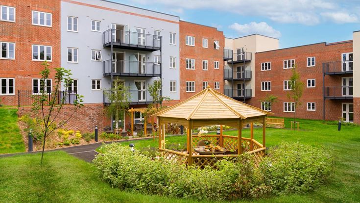 a building with a small play structure in the front