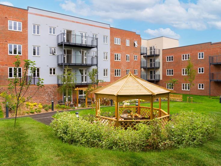 a building with a small play structure in the front