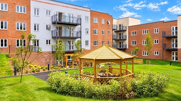 a small play structure in front of a building