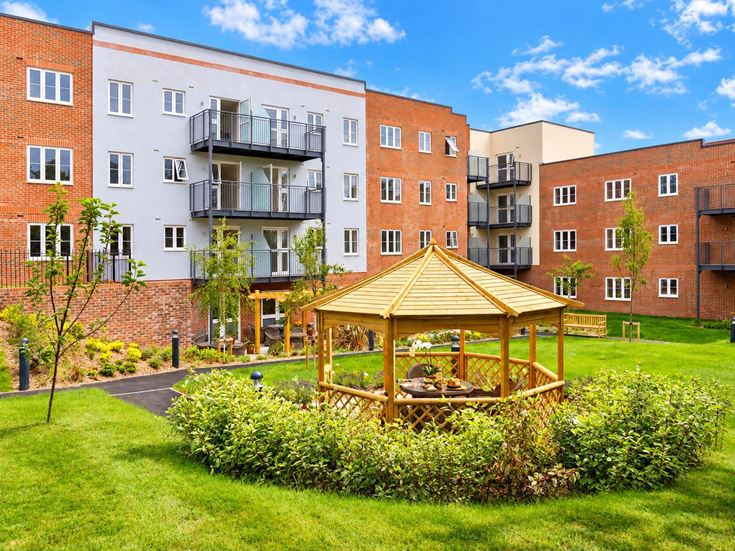 a small play structure in front of a building