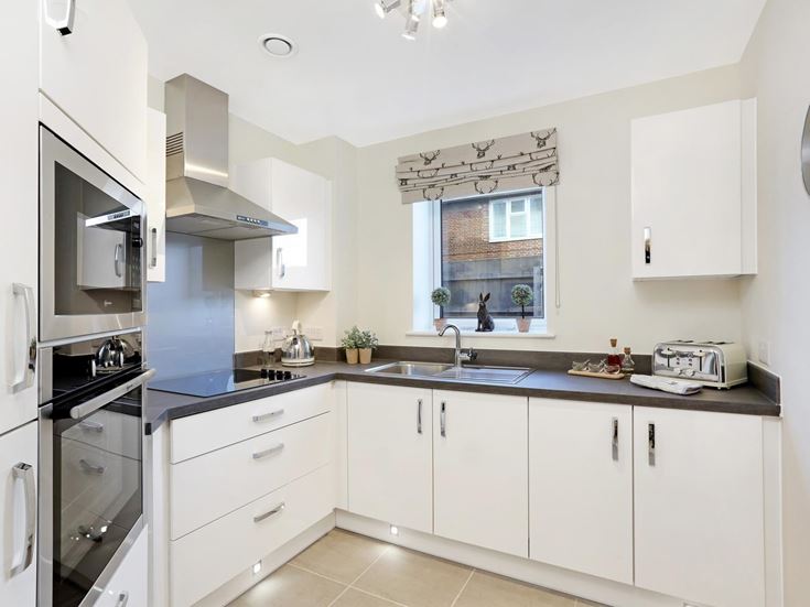 a kitchen with white cabinets