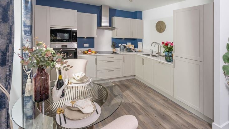 a kitchen with a table and chairs