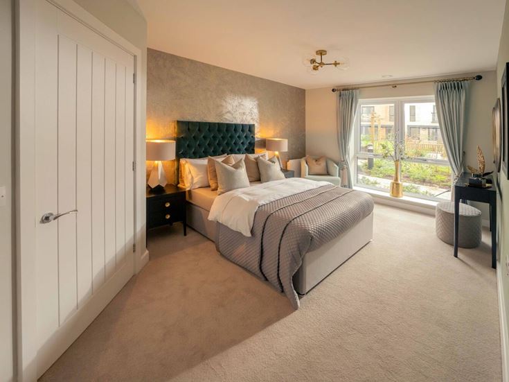 a bedroom with a large window