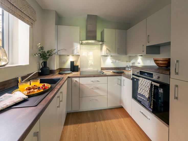 a kitchen with white cabinets
