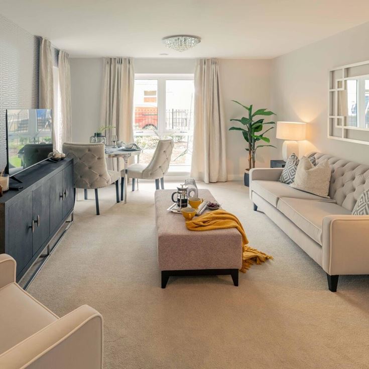 a living room with a couch and a table