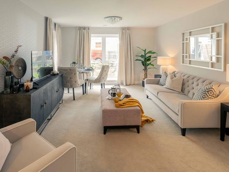 a living room with a couch and a table
