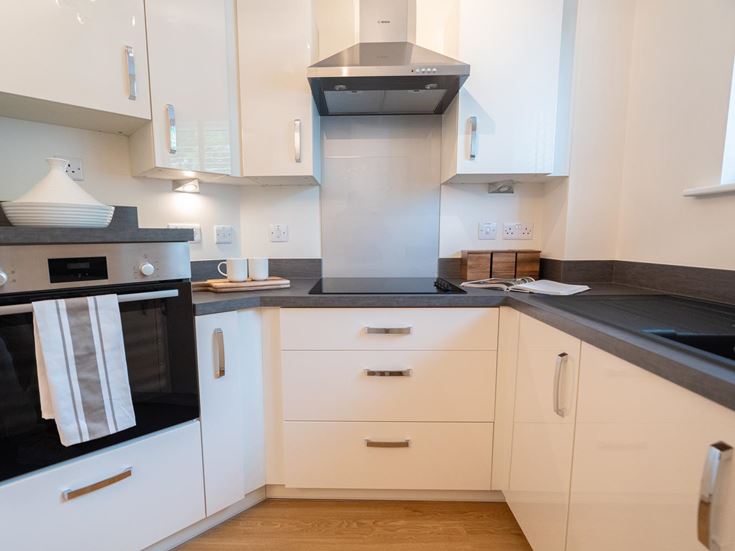 a kitchen with white cabinets