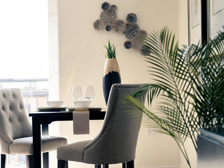 a room with a table and chairs