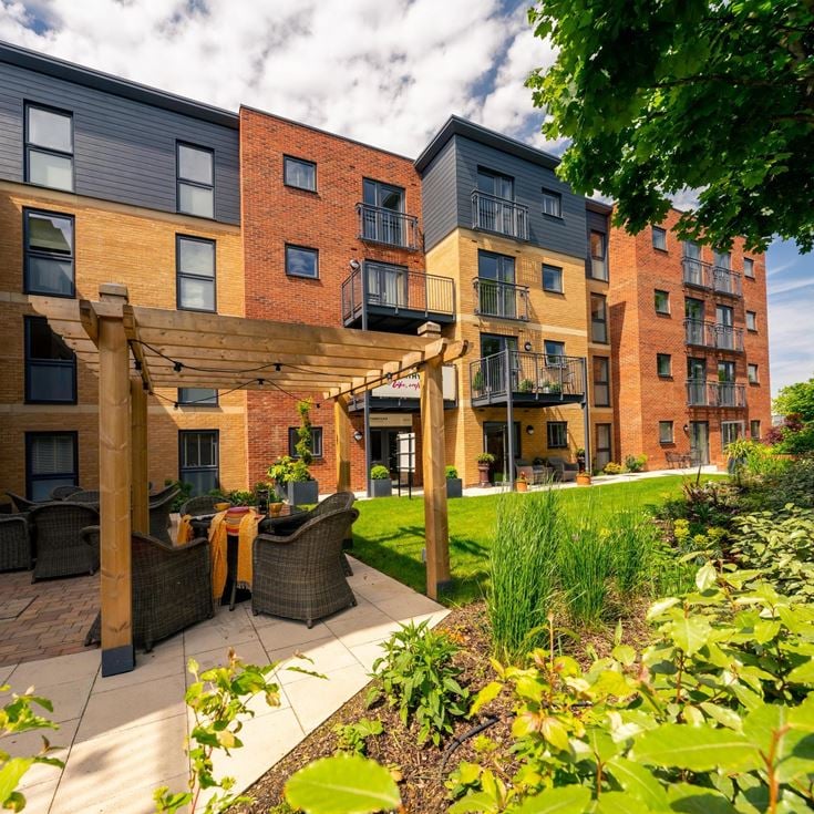 a courtyard with a building in the background
