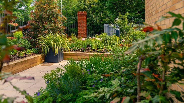 patio area with landscaped garden