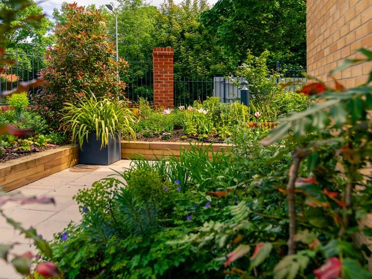 patio area with landscaped garden