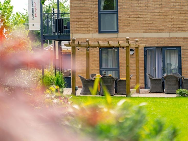 a building with a group of chairs outside