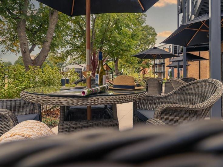 a table with a hat and umbrella
