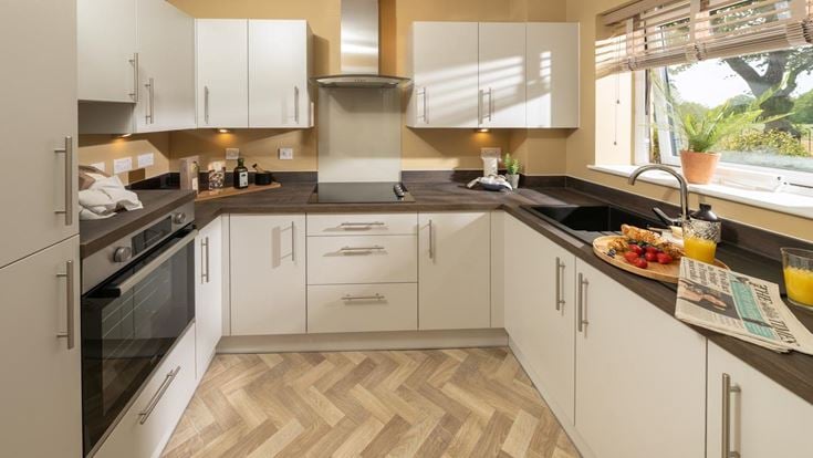 a kitchen with white cabinets