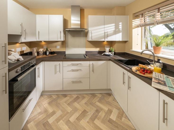 a kitchen with white cabinets
