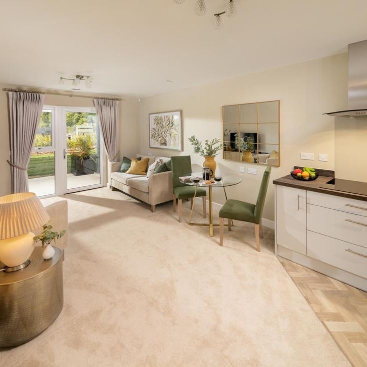 a large living room with a dining table and a couch