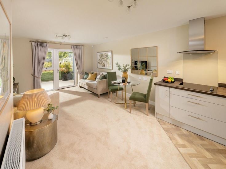 a large living room with a dining table and a couch