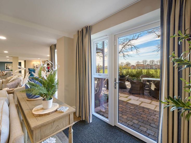 a living room with a large glass door