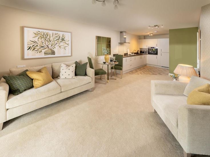 a living room with white couches