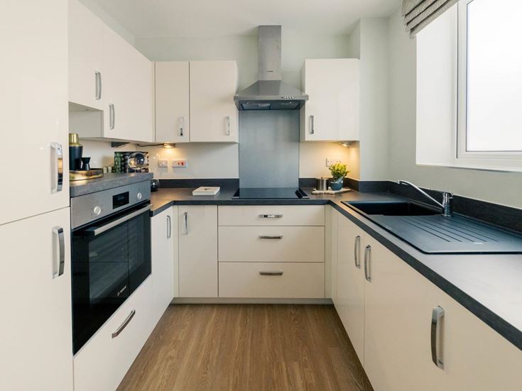 a kitchen with white cabinets
