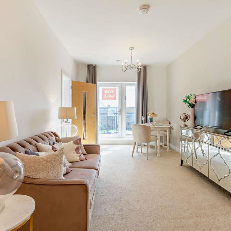 a living room with a tv and couches