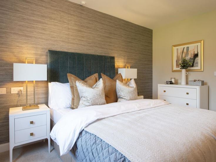 a bed with a white bed spread