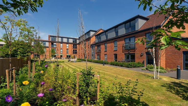 a garden in front of a building