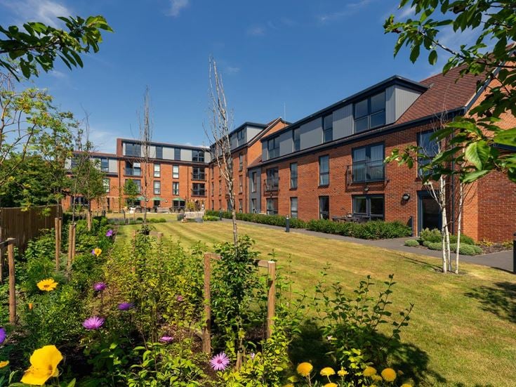 a garden in front of a building