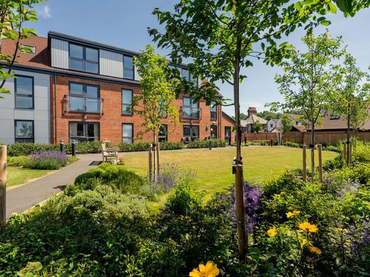 a building with a garden in front