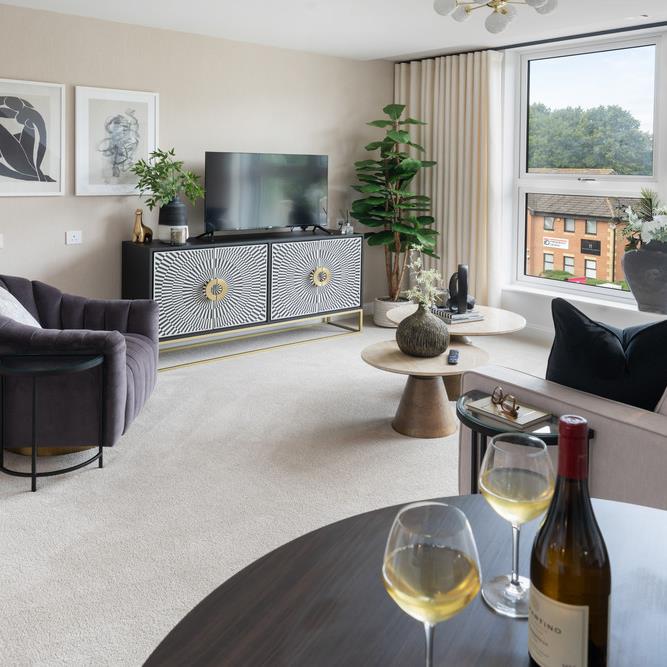 a living room with a couch and wine bottle