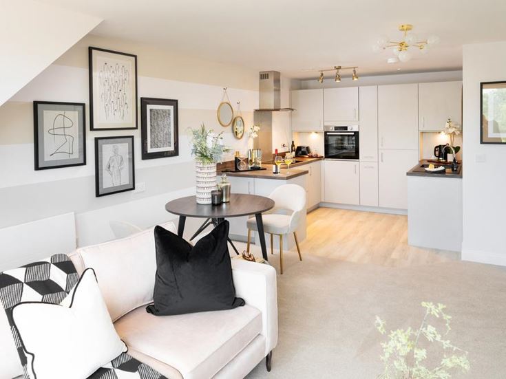 a living room with white furniture
