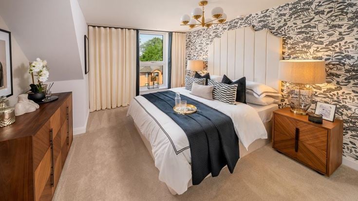 a bedroom with a bed and a table
