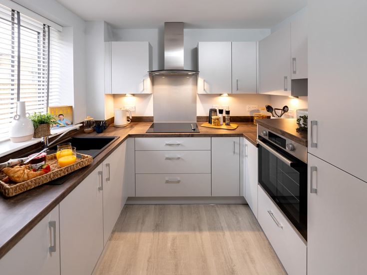a kitchen with white cabinets
