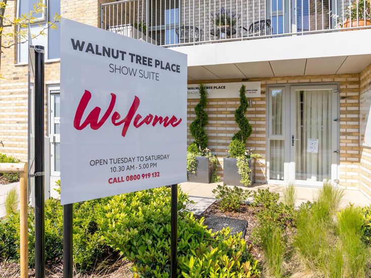 a sign in front of a building