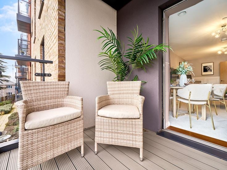 a patio with chairs and a table