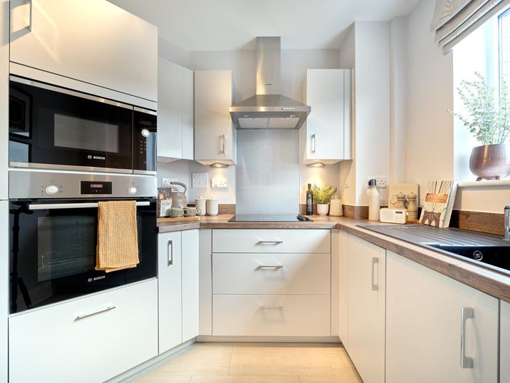 a kitchen with white cabinets