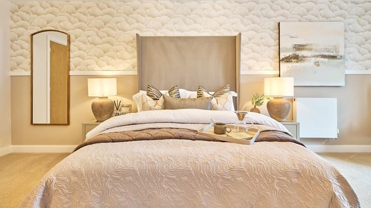 a bed with a large mirror